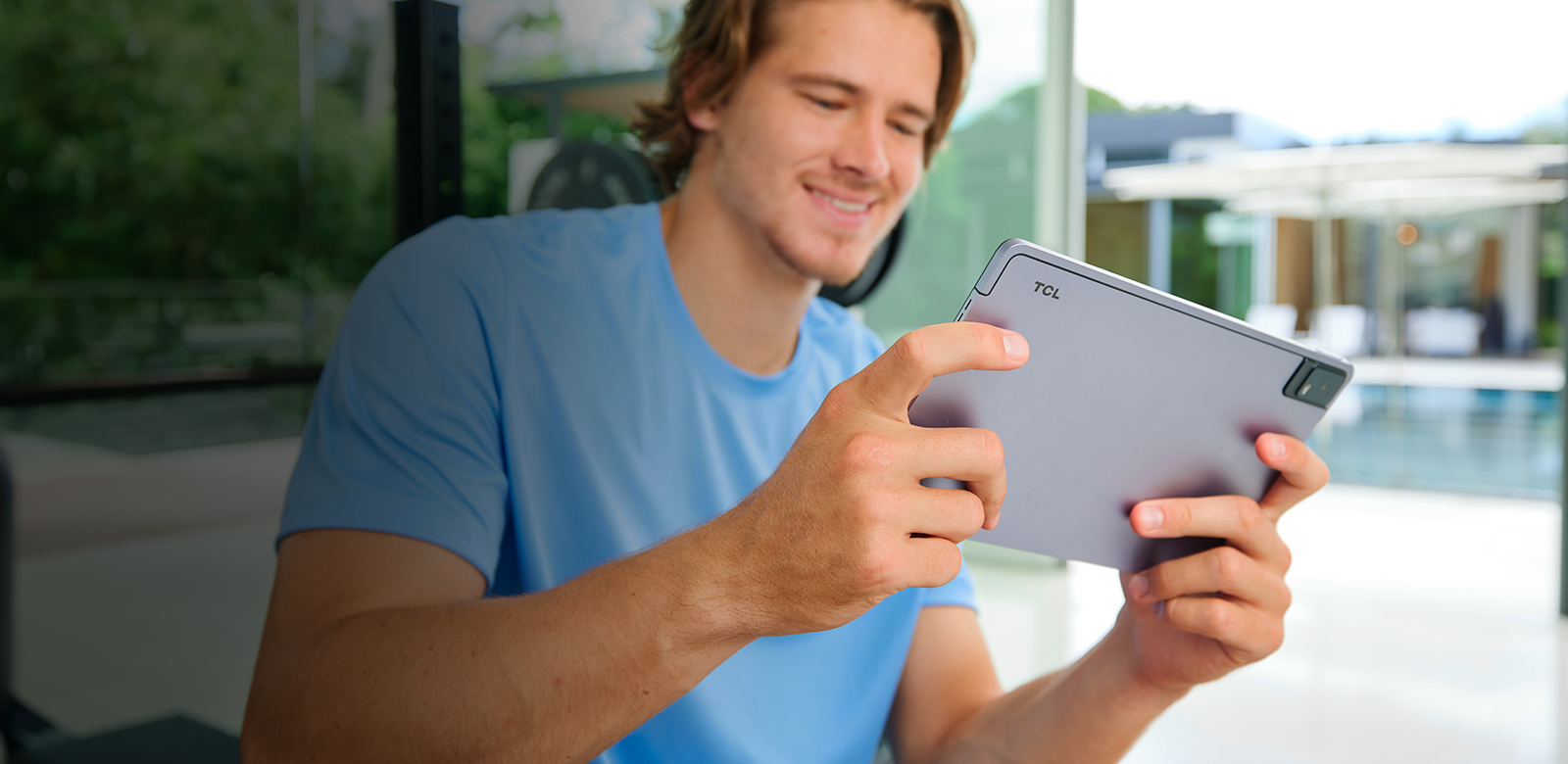 Justin Herbert watching video on tablet